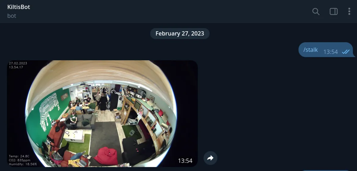 Screenshot of a chat with Kiltisbot, with the message "/stalk" being answered to by the bot with a picture of the guild room.